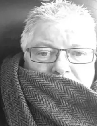 Michael J Phillips, wrapped in a herringbone scarf